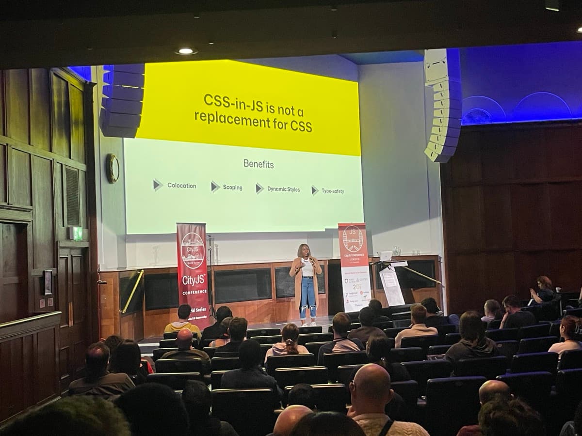 esther speaking on stage at cityjs conference